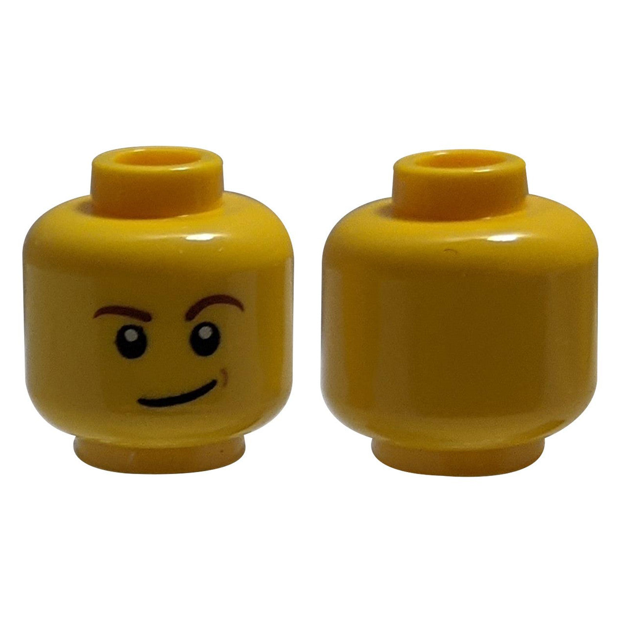 Minifigure, Head Reddish Brown Eyebrows, White Pupils, Lopsided Smile and Medium Nougat Dimple Patt