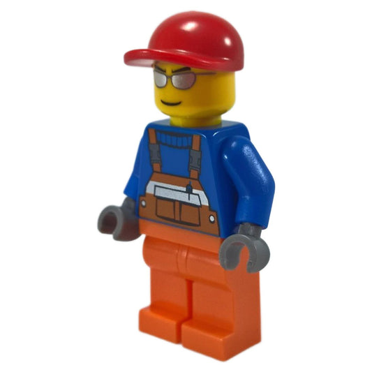 Construction Worker with Orange Overalls and Red Cap